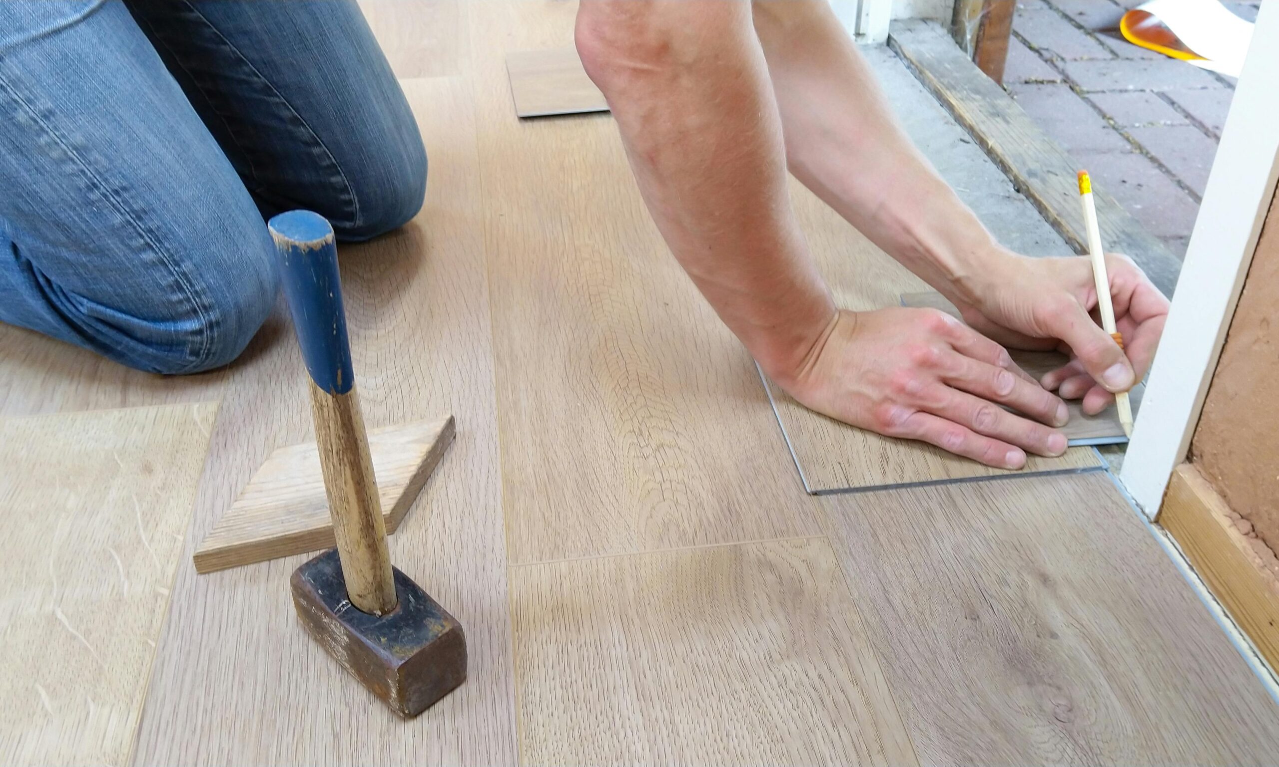 floor flooring hand man 1388944 1388944 scaled.jpg